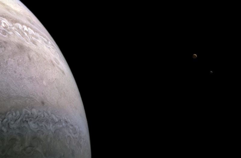 Detailed view of Io and Europa near Jupiter