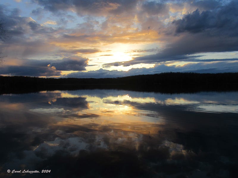 Sunset view over a serene Northern Wisconsin lake.